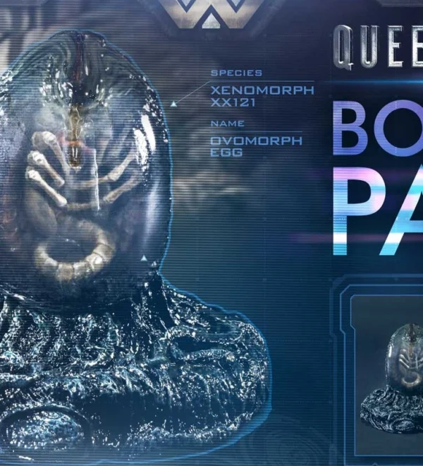 Futuristic display showing a transparent alien egg with a creature inside on a high-tech console, labeled Queen Alien Bonus Part.