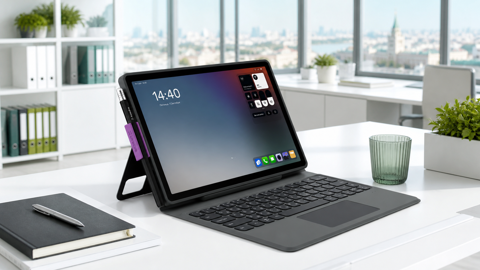 Tablet on a keyboard dock resting on a white desk in a bright office with a city view outside the window.