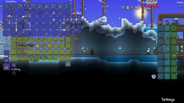 Inventory, shop and crafting menus open, with a Mining Helmet tooltip on a snowy night